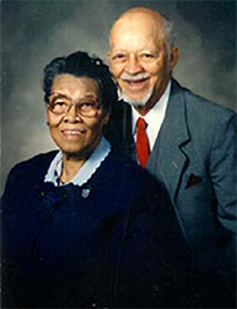 A man and woman standing next to each other.